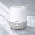 White and gray device with 'bodica' branding on a marble surface